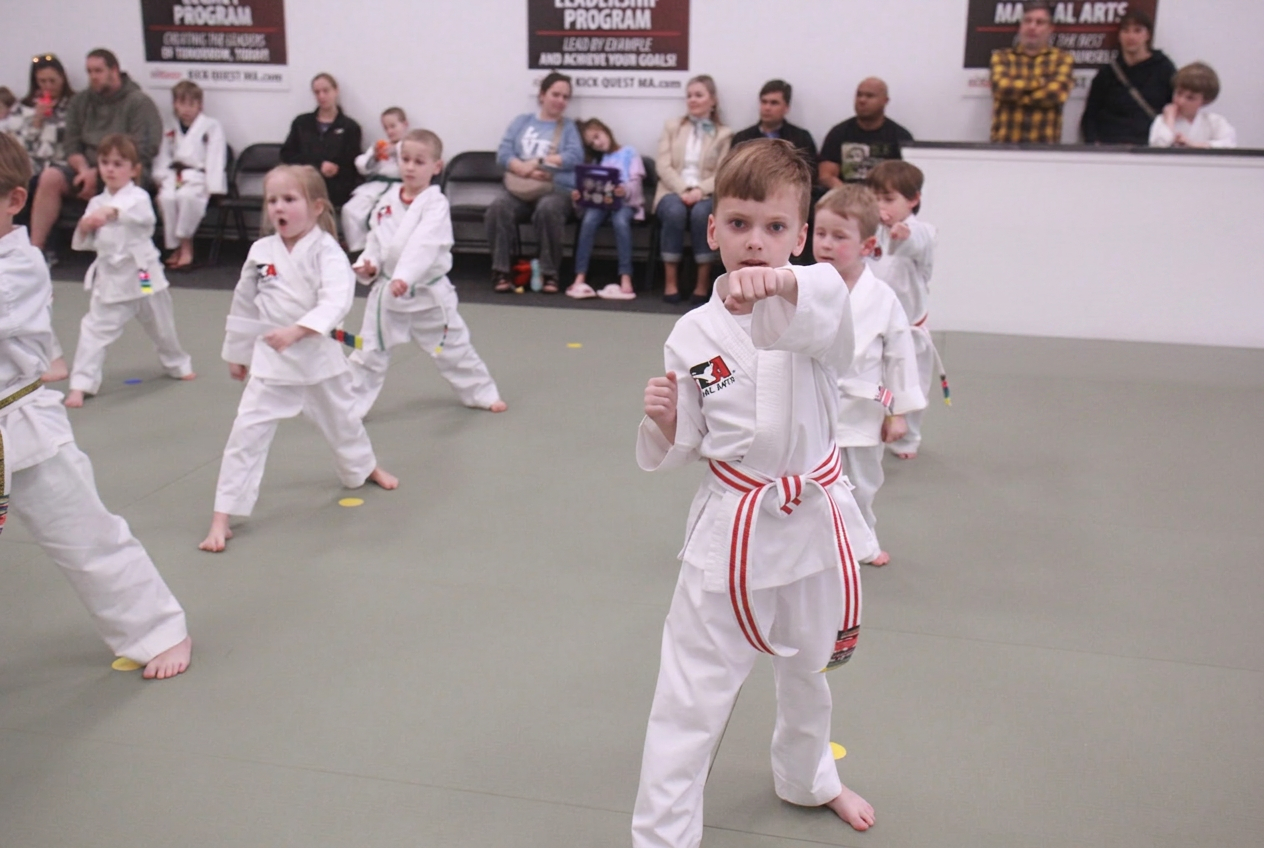 A KickQuest parent watching their child train